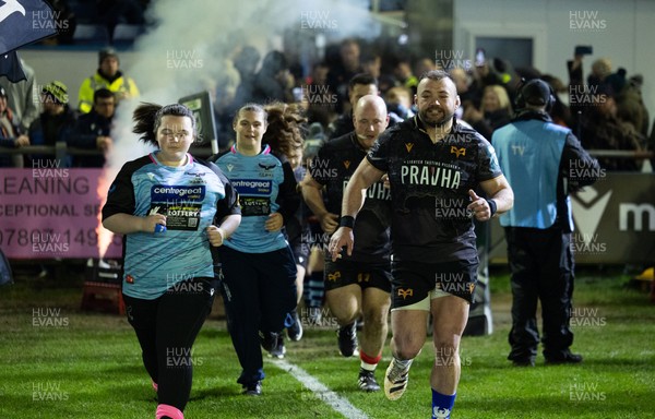 280226 - Ospreys v Ulster Rugby, United Rugby Championship - Sam Parry of Ospreys leads the team out with the mascots at the start of the match