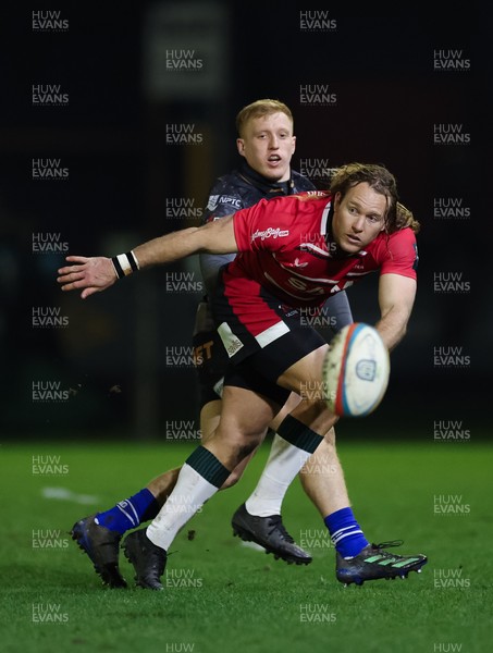280226 - Ospreys v Ulster Rugby, United Rugby Championship - Werner Kok of Ulster realises there ball as Iestyn Hopkins of Ospreys closes in