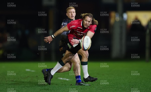 280226 - Ospreys v Ulster Rugby, United Rugby Championship - Werner Kok of Ulster realises there ball as Iestyn Hopkins of Ospreys closes in