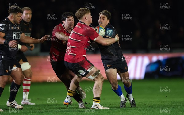 280226 - Ospreys v Ulster Rugby, United Rugby Championship - Jack Walsh of Ospreys is tackled by Bryn Ward of Ulster