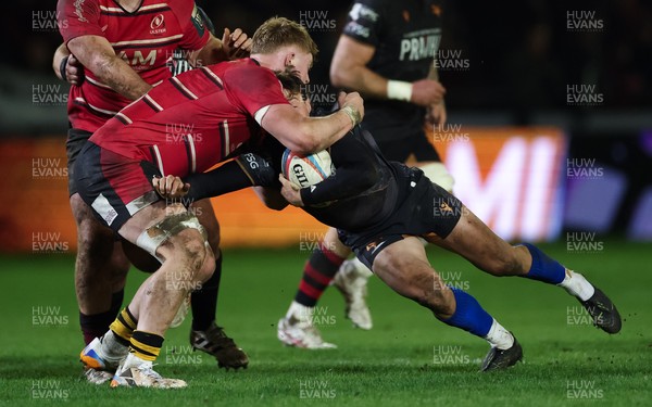 280226 - Ospreys v Ulster Rugby, United Rugby Championship - Jack Walsh of Ospreys is tackled by Bryn Ward of Ulster