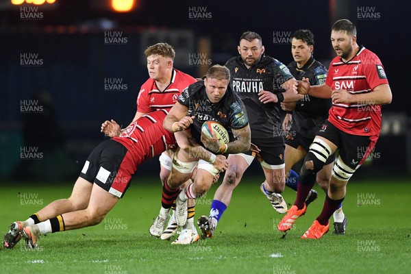280226 - Ospreys v Ulster - United Rugby Championship - Ross Moriarty of Ospreys is challenged by Tom Stewart of Ulster