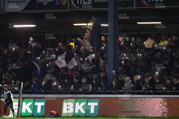280226 - Ospreys v Ulster - United Rugby Championship - Fans shine their phone lights in protest in the 11th minute after the recent decision made regarding Ospreys by the WRU