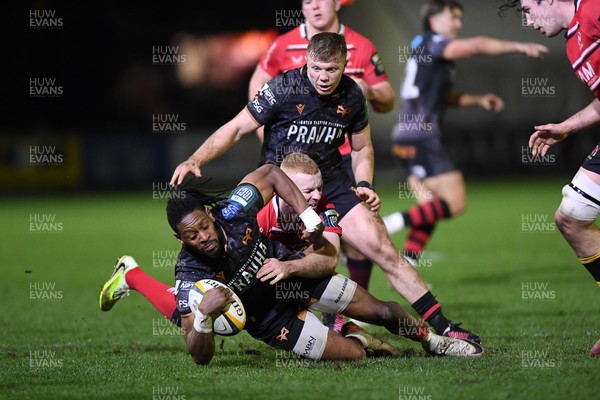 280226 - Ospreys v Ulster - United Rugby Championship - Dan Kasende of Ospreys is challenged by Nathan Doak of Ulster