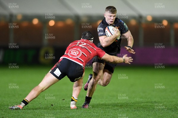 280226 - Ospreys v Ulster - United Rugby Championship - Keiran Williams of Ospreys is challenged by Jude Postlethwaite of Ulster