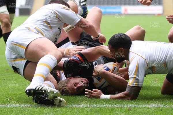 240813 - Ospreys v Worcester Warriors, Pre-season Friendly - Ospreys Ben John is tackled just short of the line