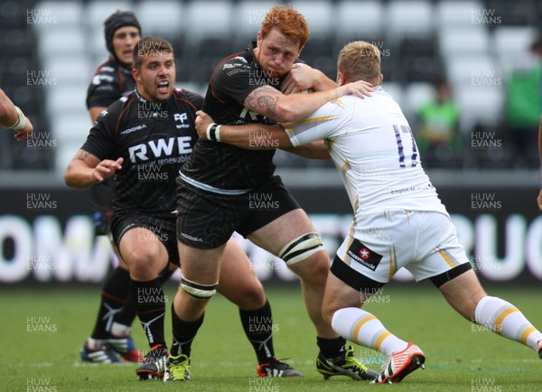 240813 - Ospreys v Worcester Warriors, Pre-season Friendly - Ospreys Dan Baker takes on Worcester's Paul Andrew