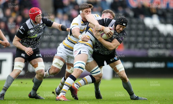 120119 - Ospreys v Worcester Warriors - European Rugby Challenge Cup - James King of Ospreys is tackled by Ted Hill of Worcester Warriors