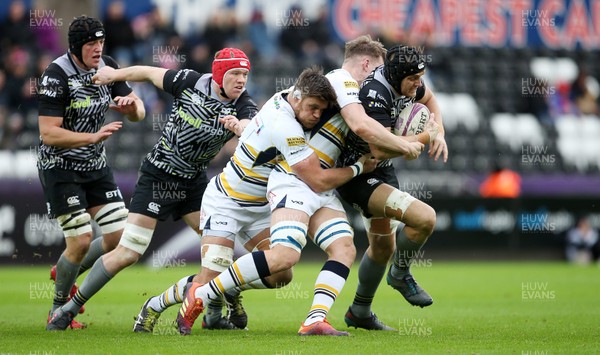 120119 - Ospreys v Worcester Warriors - European Rugby Challenge Cup - James King of Ospreys is tackled by Ted Hill of Worcester Warriors
