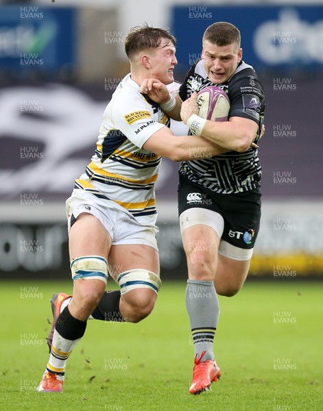 120119 - Ospreys v Worcester Warriors - European Rugby Challenge Cup - Scott Williams of Ospreys is tackled by Ted Hill of Worcester Warriors