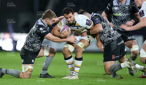120119 - Ospreys v Worcester Warriors - European Rugby Challenge Cup - Marco Mama of Worcester Warriors is tackled by Olly Cracknell and Scott Baldwin of Ospreys