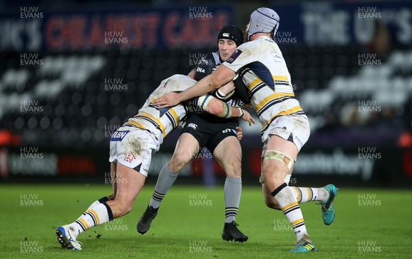 120119 - Ospreys v Worcester Warriors - European Rugby Challenge Cup - Sam Davies of Ospreys is tackled by Matt Cox and Pierce Phillips of Worcester Warriors