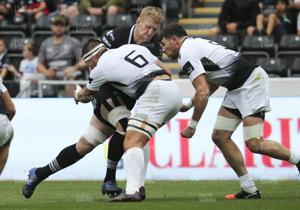 020917 - Ospreys v Zebre, Guinness PRO14 - Bradley Davies of Ospreys is tackled by Derick Minnie of Zebre and Marcello Violi of Zebre