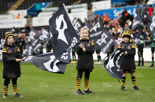 060322 - Ospreys v Zebre - United Rugby Championship - Flag bearers welcoming the team onto the pitch
