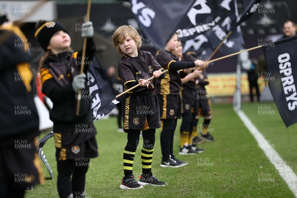 060322 - Ospreys v Zebre - United Rugby Championship - Flag bearers welcoming the team onto the pitch