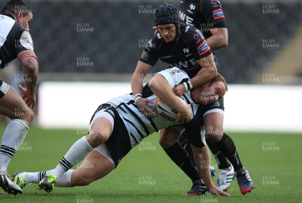 231113 - Ospreys v Zebre, RaboDirect PRO12 - Zebre's Gonzalo Garcia is held by Ospreys' Matthew Morgan