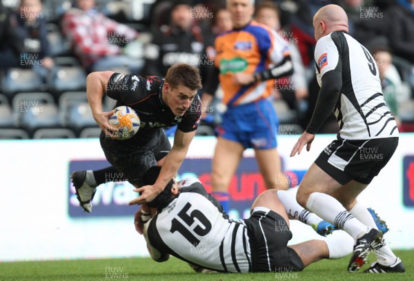 231113 - Ospreys v Zebre, RaboDirect PRO12 - Ospreys' Jeff Hassler is tackled by Zebre's Dion Berryman