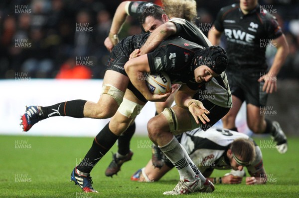 231113 - Ospreys v Zebre, RaboDirect PRO12 - Ospreys' James King is held by Zebre's Michael Van Vuren