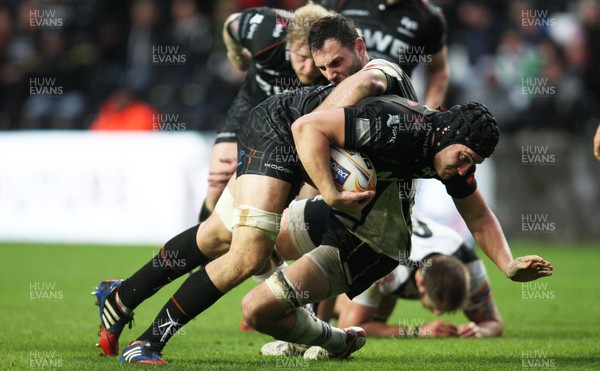 231113 - Ospreys v Zebre, RaboDirect PRO12 - Ospreys' James King is held by Zebre's Michael Van Vuren