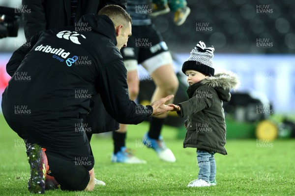 301118 - Ospreys v Zebre - Guinness PRO14 - George North of Ospreys with Scott Williams' son Seb at the end of the game