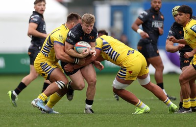 111025 - Ospreys v Zebre Parma - United Rugby Championship - Keiran Williams of Ospreys is tackled by Giampietro Ribaldi and Iacopo Bianchi of Zebre Parma 