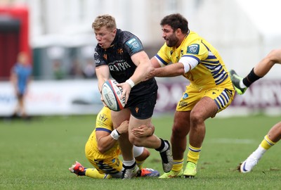 111025 - Ospreys v Zebre Parma - United Rugby Championship - Keiran Williams of Ospreys is tackled by Simone Gesi of Zebre Parma 