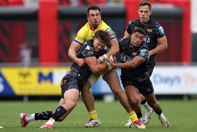111025 - Ospreys v Zebre Parma - United Rugby Championship - Jack Walsh of Ospreys is tackled by Enrico Lucchin of Zebre Parma 