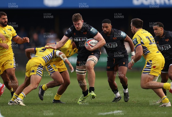 111025 - Ospreys v Zebre Parma - United Rugby Championship - James Ratti of Ospreys smashes past Thomas Dominguez of Zebre Parma 