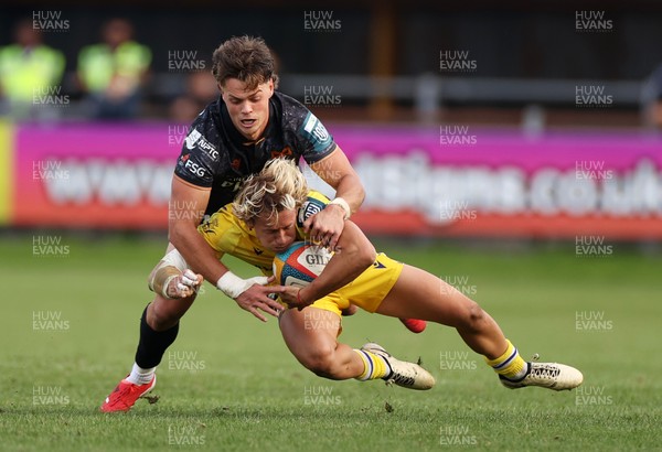 111025 - Ospreys v Zebre Parma - United Rugby Championship - Thomas Dominguez of Zebre Parma is tackled by Jack Walsh of Ospreys 