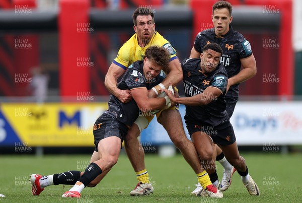111025 - Ospreys v Zebre Parma - United Rugby Championship - Jack Walsh of Ospreys is tackled by Enrico Lucchin of Zebre Parma 