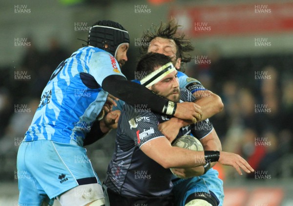 280315 - Ospreys v Zebre - GuinnessPro12 -Scott Baldwin of Ospreys is tackled by Marco Bortolami(5) and Andrea De Marchi of Zebre