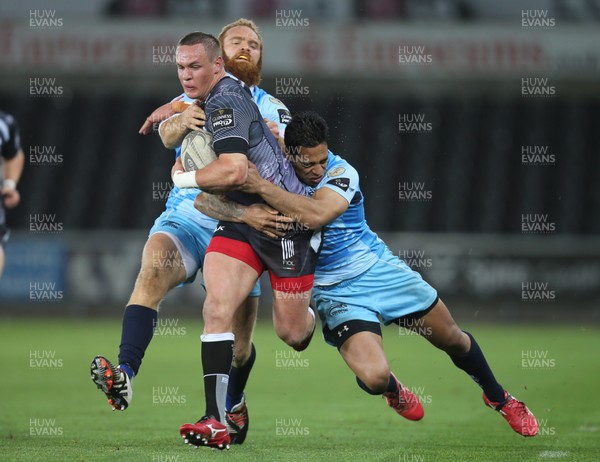 280315 - Ospreys v Zebre Rugby, Guinness PRO12 - Ospreys Hanno Dirksen is tackled by Zebre's Dion Berryman and Zebre's Gonzalo Garcia