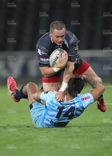 280315 - Ospreys v Zebre Rugby, Guinness PRO12 - Ospreys Hanno Dirksen is tackled by Zebre's Dion Berryman