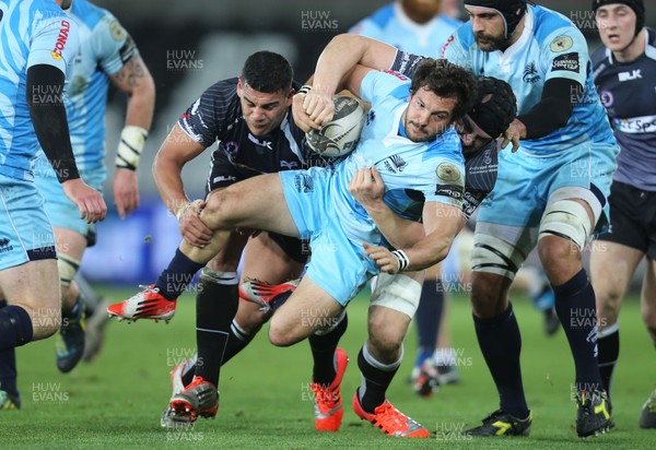 280315 - Ospreys v Zebre Rugby, Guinness PRO12 - Zebre's Guglielmo Palazzani is tackled by Ospreys Josh Matavesi and Ospreys James King