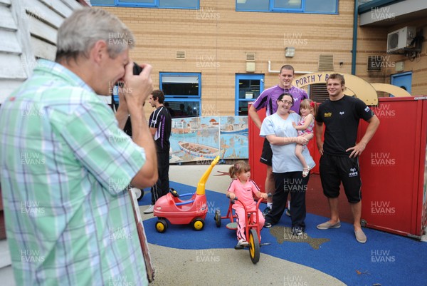 27.07.11 - Ospreys Visit Y Bont Family Centre - Ian Eavns and Dan Biggar with children at Y Bont family centre, Bridgend. 