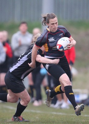 28.04.10 - Ospreys Women v Dragons Women -  Dragons Victoria White is tackled by Ospreys Jamie Davies 