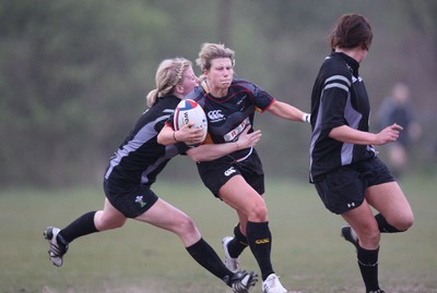 28.04.10 - Ospreys Women v Dragons Women -  Dragons Mared Evans is tackled by Ospreys Carys John 