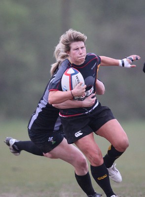 28.04.10 - Ospreys Women v Dragons Women -  Dragons Mared Evans is tackled by Ospreys Carys John 