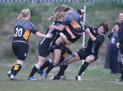 28.04.10 - Ospreys Women v Dragons Women -  Dragons Leila Johns is hauled into touch 