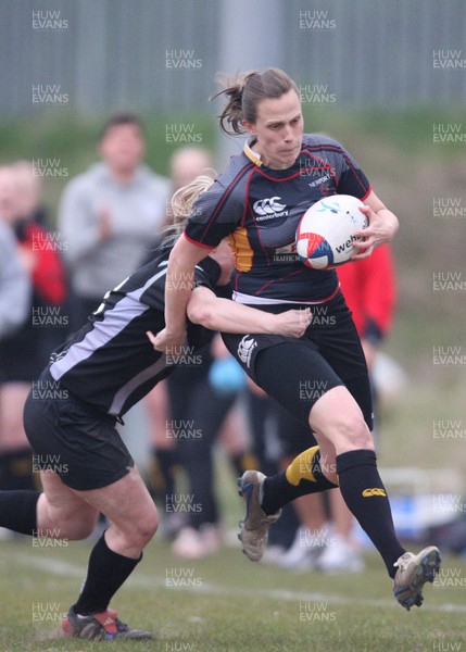 28.04.10 - Ospreys Women v Dragons Women -  Dragons Victoria White is tackled by Ospreys Jamie Davies 