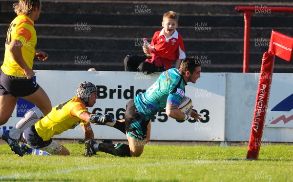 10.08.10 - Ospreys v Ospreys Regional XV. Ospreys Kristian Phillips scores a try as Nathan Edwards tackles 