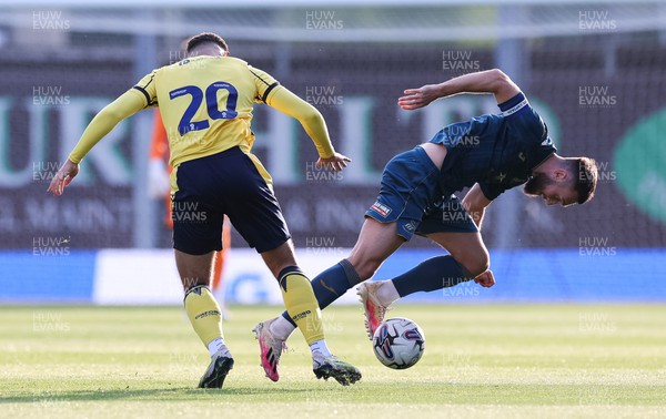 210723 - Oxford United v Swansea City, Pre-season Friendly - Matt Grimes of Swansea City is tackled by Ruben Rodrigues of Oxford United