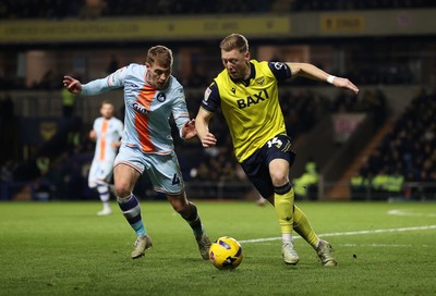 291225 - Oxford United v Swansea City - SkyBet Championship - Brian De Keersmaecker of Oxford United is tackled by Jay Fulton of Swansea City 
