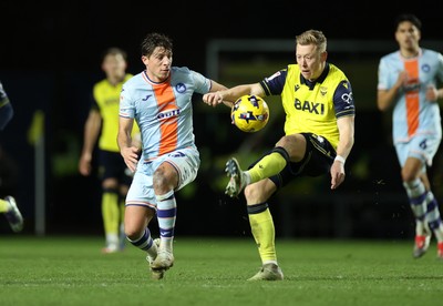 291225 - Oxford United v Swansea City - SkyBet Championship - Goncalo Franco of Swansea City is tackled by Brian De Keersmaecker of Oxford United 