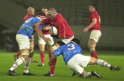 130601 - Pacific Barbarians v Wales -Chris Stephens is tackled by Jamie Washington and Hong Jung-Pyo