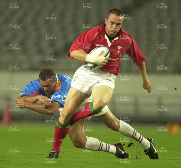 130601 - Pacific Barbarians v Wales -Rhys Williams beats tackle by Walter Little