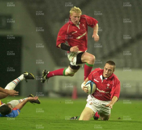 130601 - Pacific Barbarians v Wales -Rhys Williams goes to ground after being ankle tapped by Walter Little (l) as Jamie Ringer comes in to support