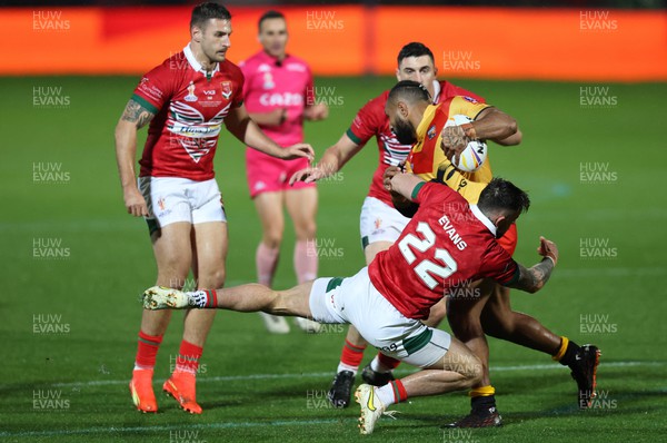 311022 - Papua New Guinea v Wales - Rugby League World Cup 2021 - Kyle Evans of Wales Rugby League tackles Justin Olam of PNG