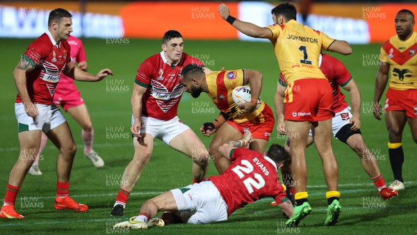311022 - Papua New Guinea v Wales - Rugby League World Cup 2021 - Kyle Evans of Wales Rugby League and Gavin Bennion of Wales Rugby League tackles Justin Olam of PNG