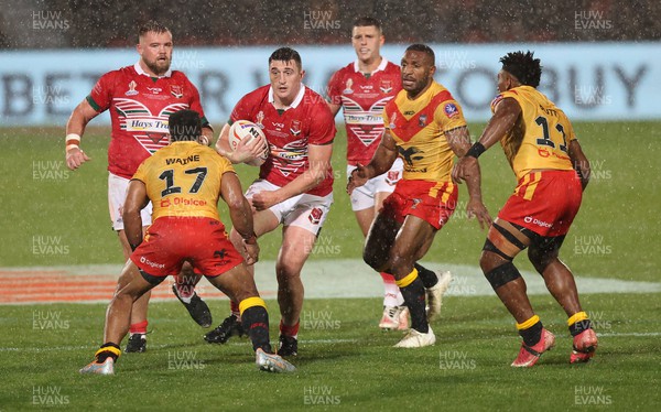 311022 - Papua New Guinea v Wales - Rugby League World Cup 2021 - Joe Burke of Wales Rugby League tries to run thru the PNG defence  